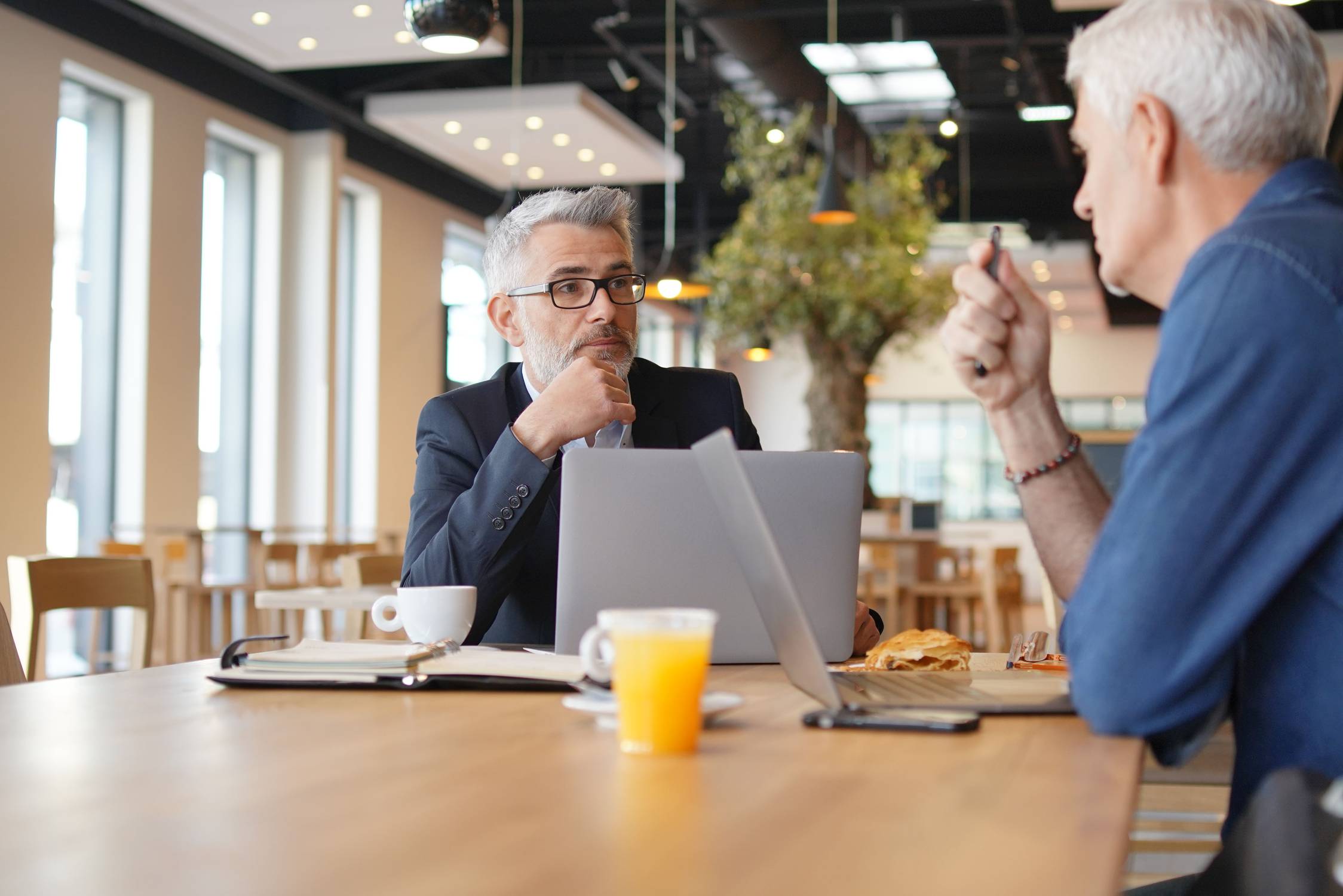 Work colleagues discussing ideas in informal business meeting